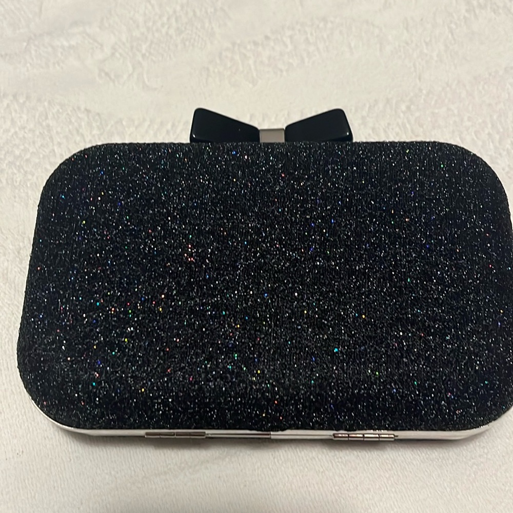 Super cute black clutch with black bow clasp with chain for shoulder wear